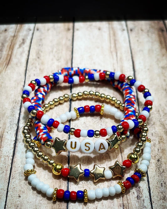 “Gold USA” bracelet stack